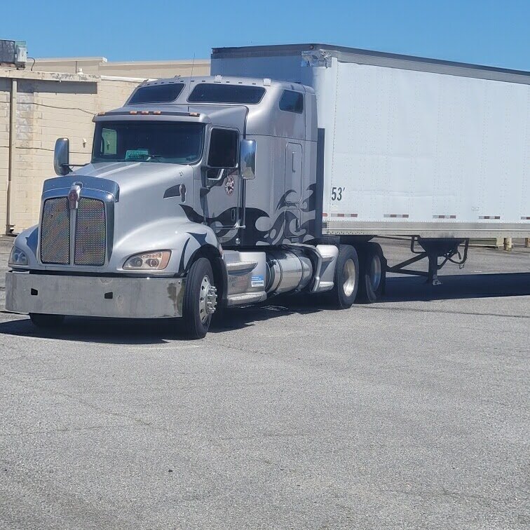 Truck and trailer at warehouse dock